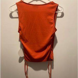 A Medium Orange Tank Top From Milk & Honey